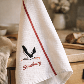 Torchon Nid d'abeilles Cigogne Envol Strasbourg Blanc/Rouge 50 x 70